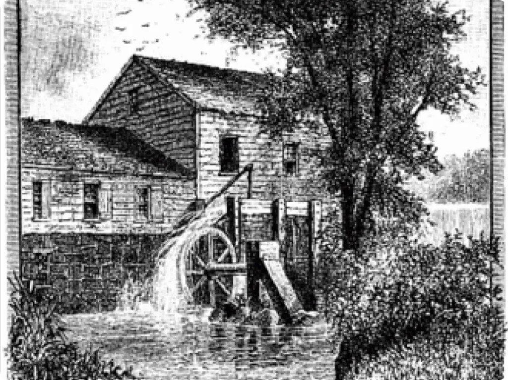 A black and white illustration of an old wooden watermill by a river, with water flowing over a large wheel and trees in the background.